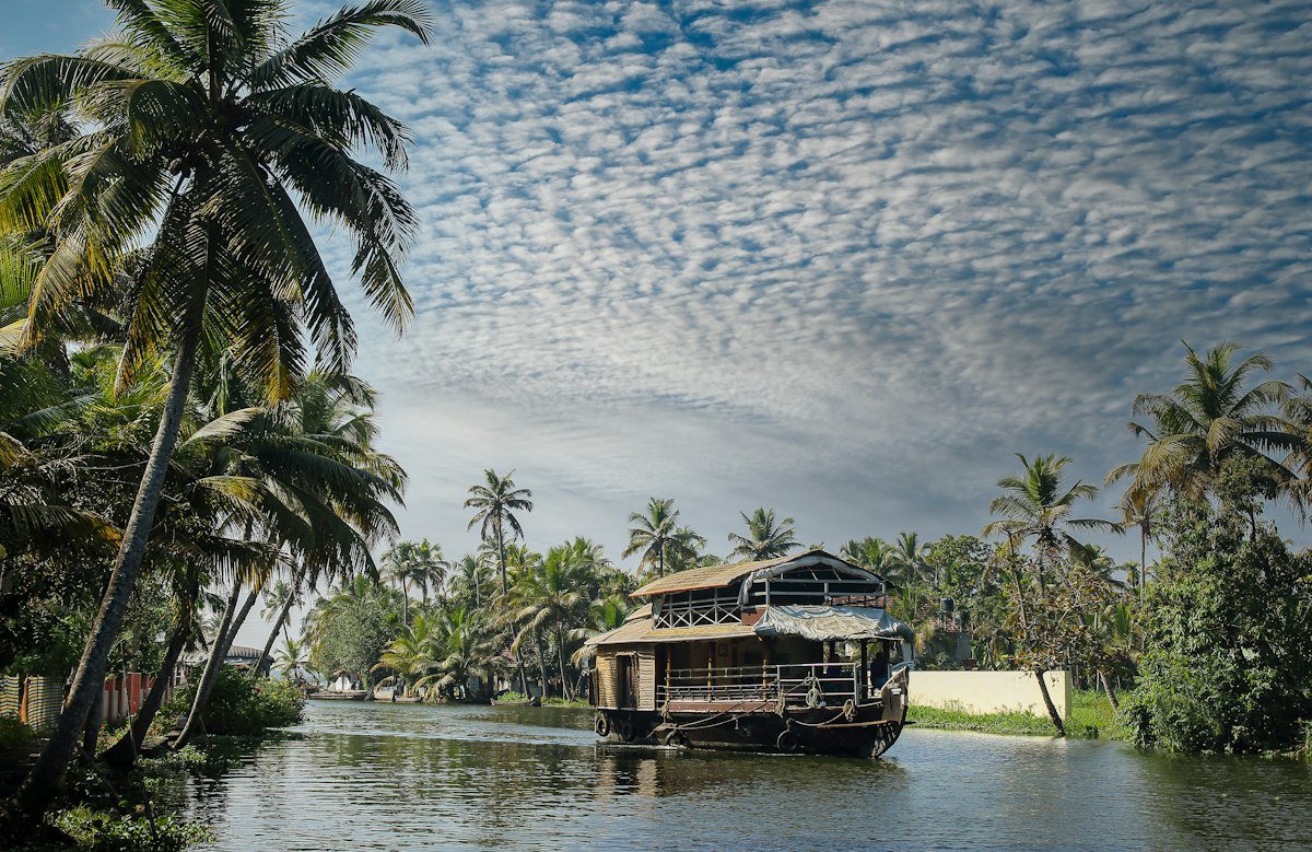 Traditional houseboat cruising through Kerala backwaters